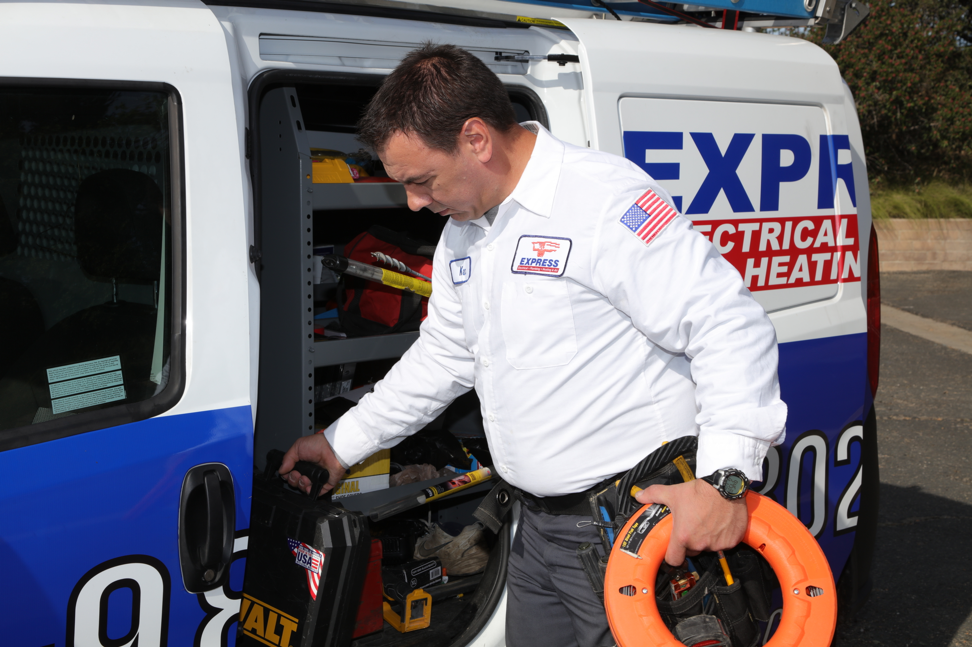 express electrical technician grabbing his tools from van