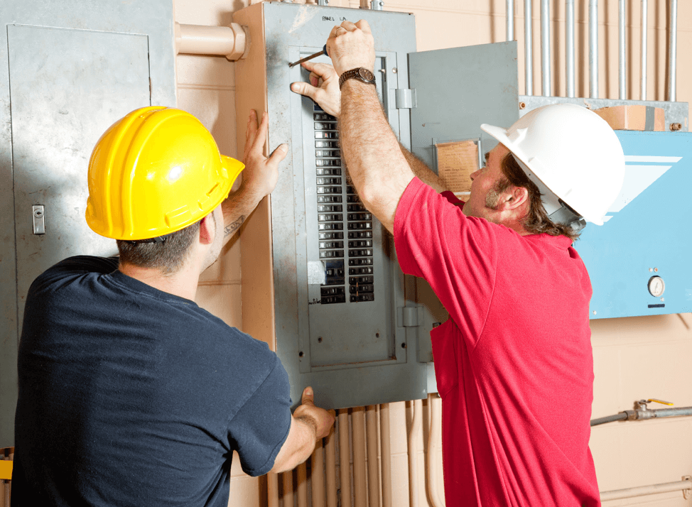 electricians repairing circuit breaker panel