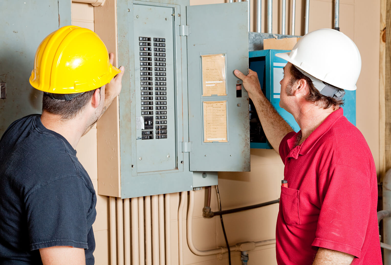 Repairmen-Reading-Electrical-Circuit Breaker Panel-