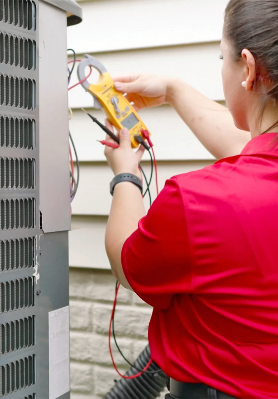 Tech Carrying Out HVAC Maintenance