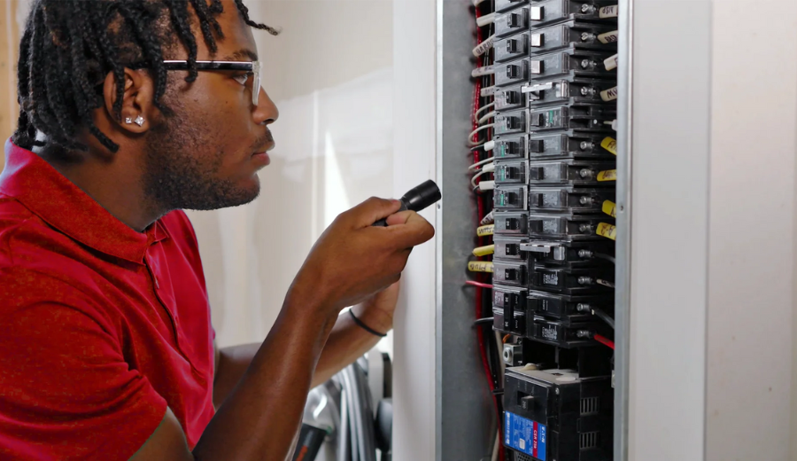 Technician Inspecting Electrical Panel